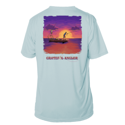 A Grateful Angler Skeleton Anglers Short Sleeve UV Shirt with an image of a boat at sunset.