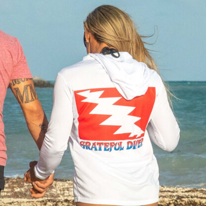 Grateful Diver Classic UV Shirt Hoodie in white back shot on model on beach