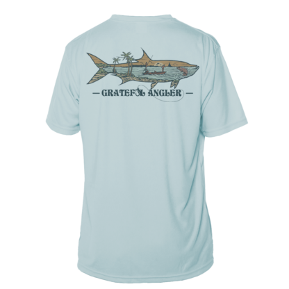 A light blue Grateful Angler Keys Tarpon Short Sleeve UV Shirt with a shark on it.
