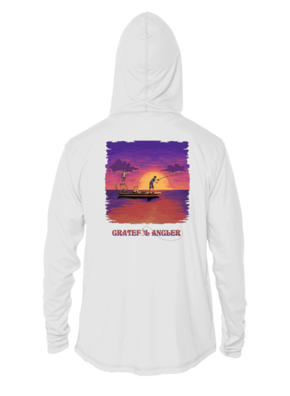A Grateful Angler Skeleton Anglers UV Hoodie with an image of a boat at sunset.