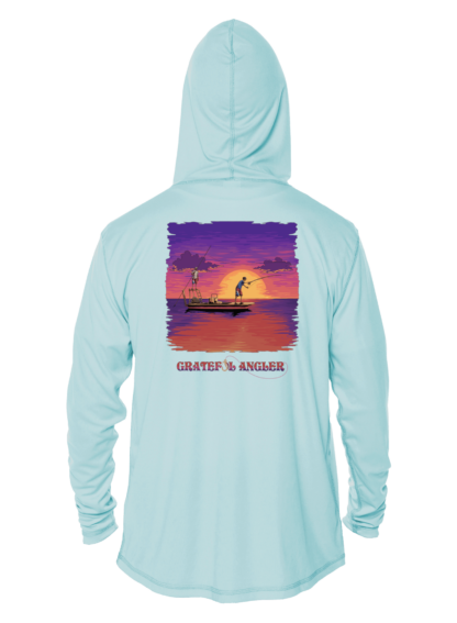 A Grateful Angler Skeleton Anglers UV Hoodie with an image of a boat at sunset.