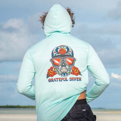 The back of a man wearing a Grateful Diver Sugar Skull UPF 50+ Hoodie.