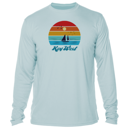 A long - sleeve t - shirt with an image of a sailboat and sunset.