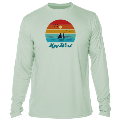 A long - sleeved t - shirt with an image of a sailboat and sunset.