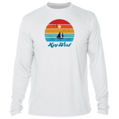 A white long - sleeve t - shirt with a sailboat and sunset.