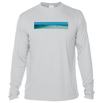 A long-sleeve rash guard with a view of the ocean.