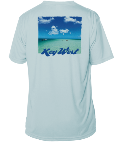 A light blue UV shirt with an image of the beach and clouds.