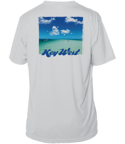 A white sun shirt with an image of the beach and clouds.