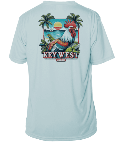 A light blue rash guard with an image of a rooster and palm trees.