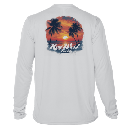 A white long-sleeve swim shirt with a sunset and palm trees.