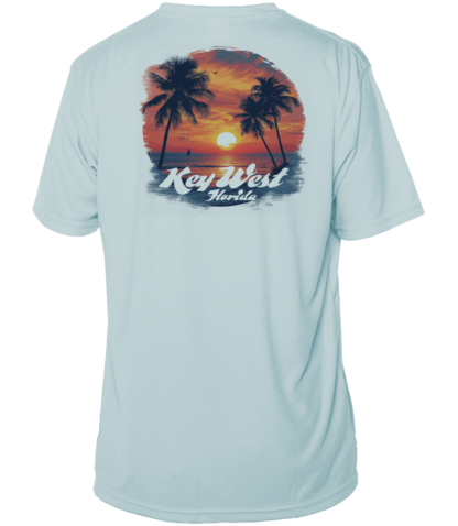 A light blue sun shirt with palm trees and a sunset.