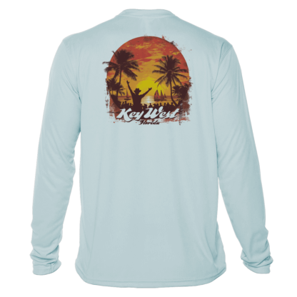 A light blue long sleeve sun shirt with an image of a sunset and palm trees.