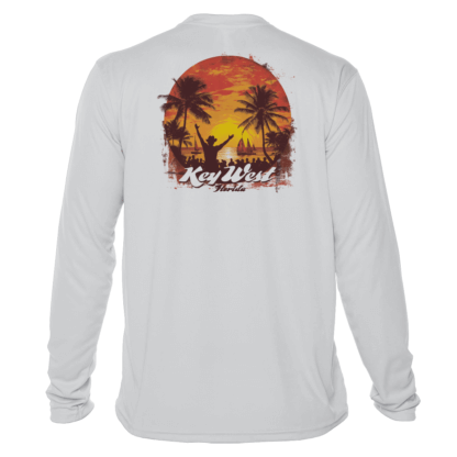 A white long sleeve sun shirt with an image of a sunset and palm trees.