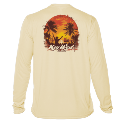 A long-sleeved swim shirt with an image of a sunset and palm trees.