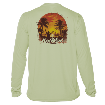 A long sleeve uv shirt with an image of a sunset and palm trees.