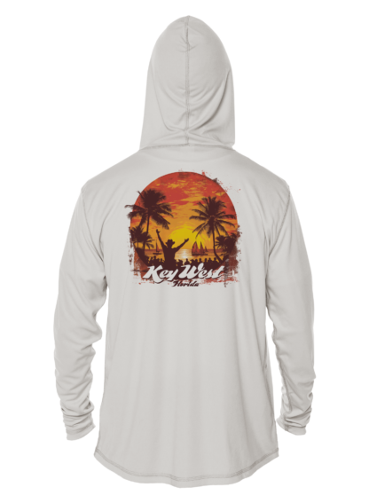 An UPF sun protective clothing with an image of a sunset and palm trees.