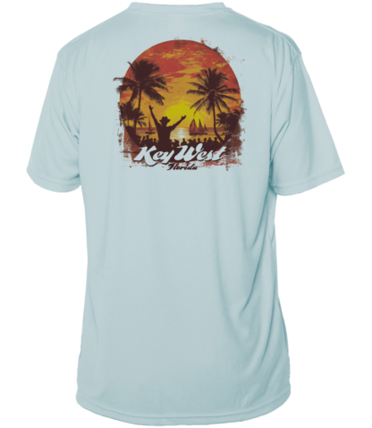A light blue UV shirt with an image of a sunset and palm trees.