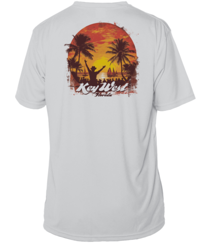 A white t-shirt with an image of a sunset and palm trees. This shirt also functions as sun protective clothing, offering UV protection.
Keywords: sun protective clothing
